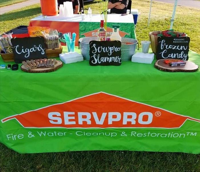 a SERVPRO tent set up with candy and drinks on the table